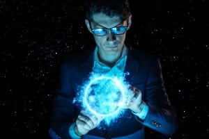 Man businessman holding hands over a blue glowing plasma sphere. Magic prediction and foresight in business and Finance